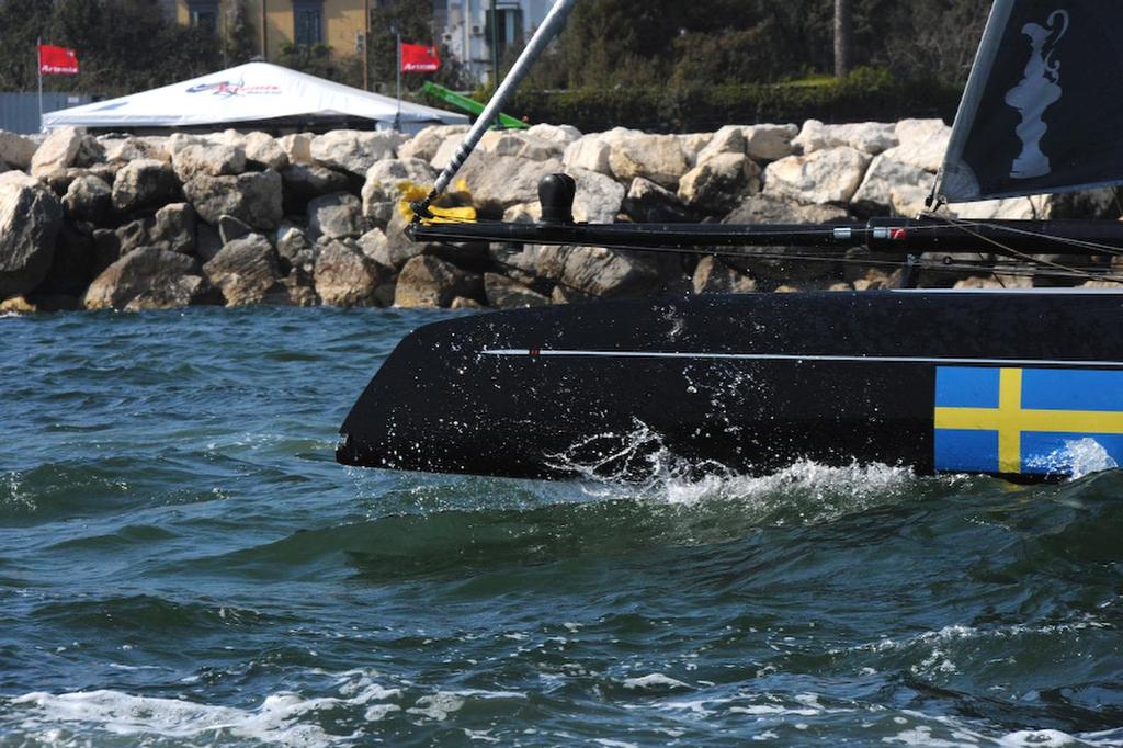 Artemis comes home wounded. Notice a chunk missing on the front end of the pontoon as they pull into port on the Bay of Napoli?  April 19, 2013. photo copyright  SW taken at  and featuring the  class