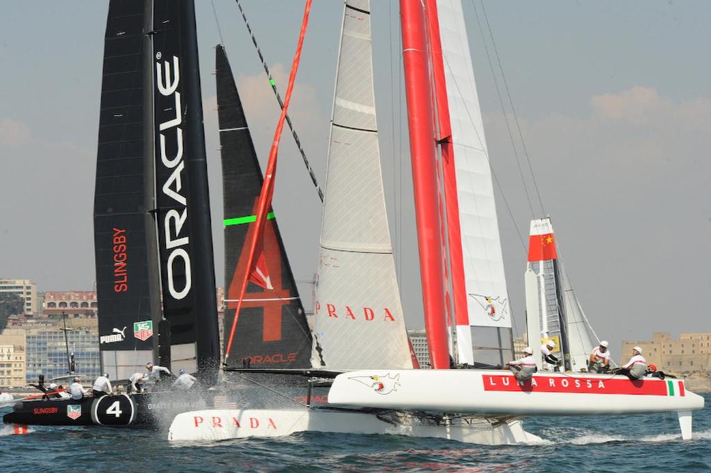 In the first Fleet Race of the day Oracle Team USA Slingsby places first and Luna Rossa Swordfish places third on the Bay of Napoli here in Italy on April 19, 2013 for the ACWS. ©  SW