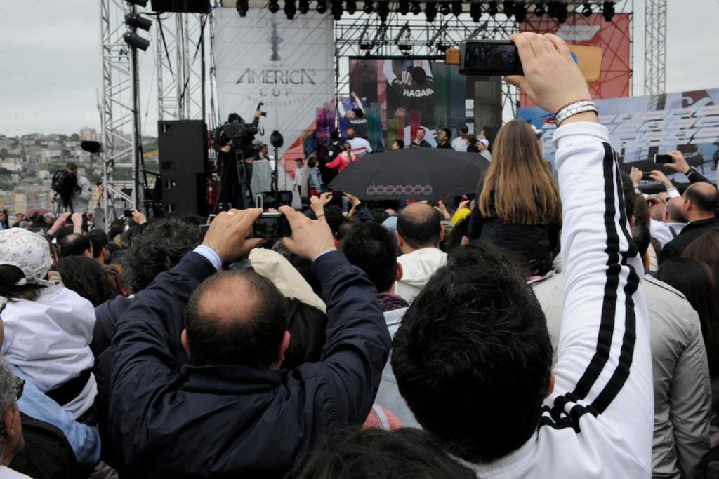 Spectators come to the awards ceremony at the stage area to see their favorite team at the ACWS in Naples Italy April 21, 2013. photo copyright  SW taken at  and featuring the  class