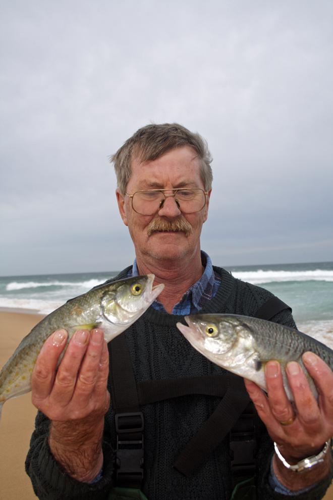 Neil holds two nice salmon caught on blue bait. © Jarrod Day