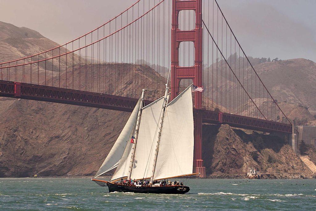 The replica of the yacht America under sail at the Golden Gate bridge on race day.  - America’s Cup 2013 © Chuck Lantz http://www.ChuckLantz.com