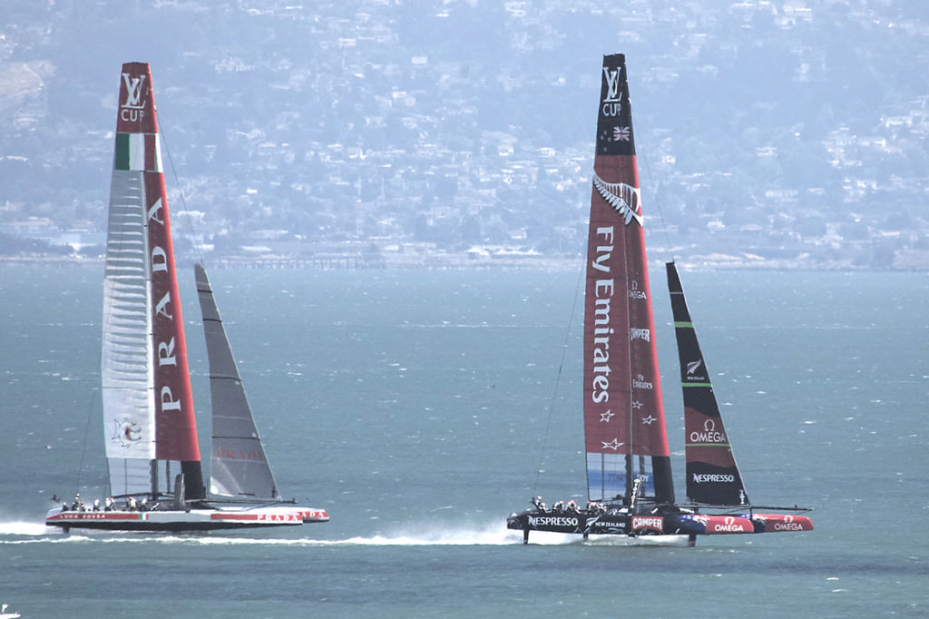 ETNZ flies downwind on her foils, with Prada trailing during practice session - America's Cup © Chuck Lantz http://www.ChuckLantz.com