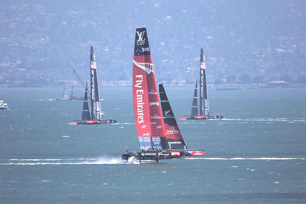 ETNZ, framed in the background by Oracle's AC72s - America's Cup photo copyright Chuck Lantz http://www.ChuckLantz.com taken at  and featuring the  class