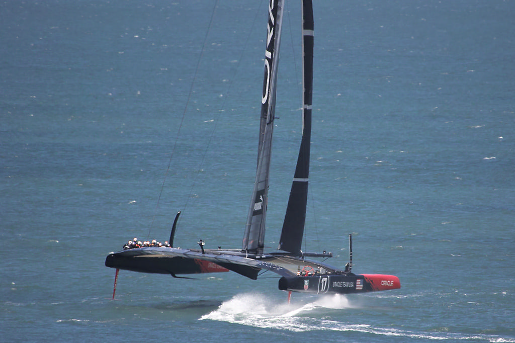 One of Oracle's two AC72s turns out of a gybe, getting set to fire the afterburners for a downwind ride. - America's Cup © Chuck Lantz http://www.ChuckLantz.com