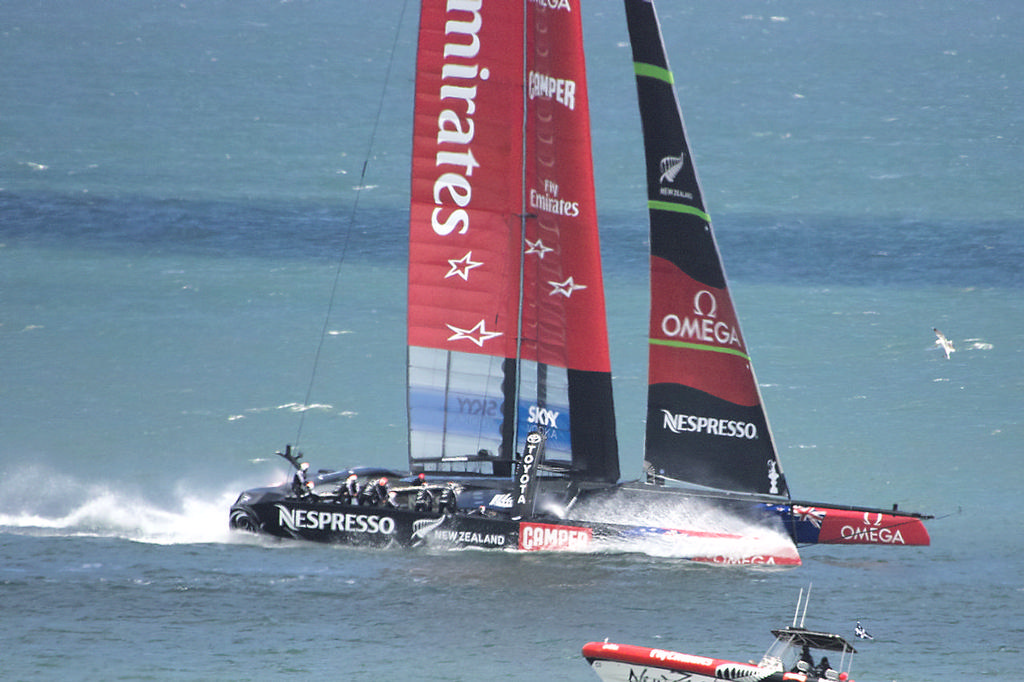 ETNZ splashes down as it comes off her foils.  - America's Cup © Chuck Lantz http://www.ChuckLantz.com