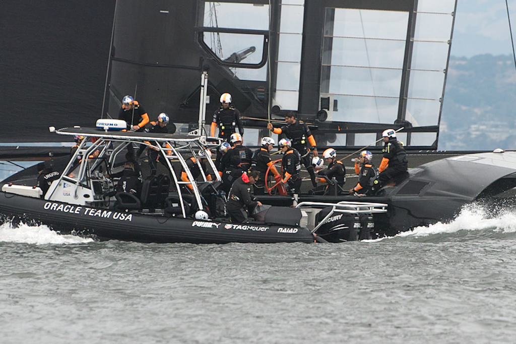 Crew changes and adjustments during Oracle's practice session. - America's Cup © Chuck Lantz http://www.ChuckLantz.com
