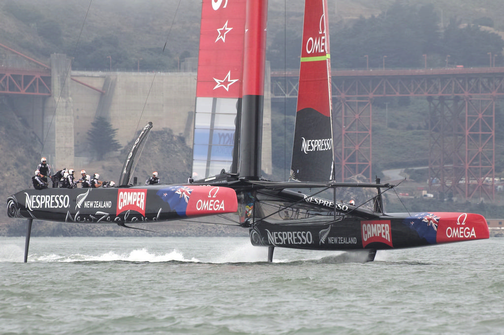 ETNZ blasts by, prior to the start sequence. - America's Cup © Chuck Lantz http://www.ChuckLantz.com