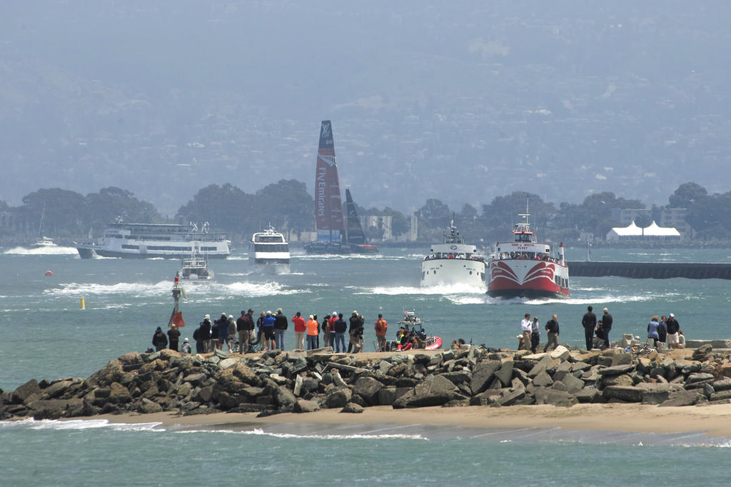 ETNZ hits the finish line as spectators watch from the spit near the Golden Gate YC.  - America's Cup © Chuck Lantz http://www.ChuckLantz.com