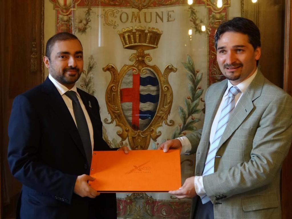 WPPA Vice President Dr Khalid Al  Zahed (left) with the Mayor of Stresa, Mr Canio Di Milia after signing an agreement to host the first international XCAT World Series race in Italy next month. photo copyright Karien Jonckheere taken at  and featuring the  class