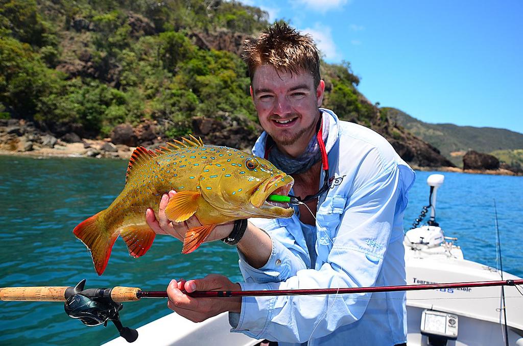 Lee Brake with a lovely coral trout taken on a Berkley Gulp Soft Plastic flicked along a rocky island edge. © Lee Brake