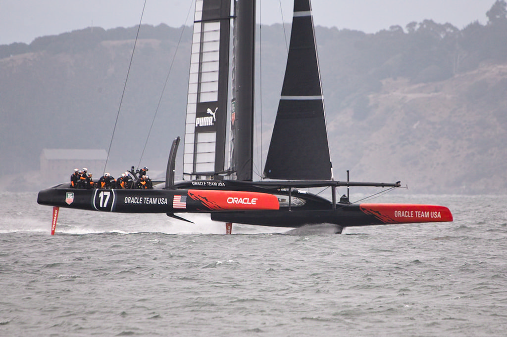 Oracle getting the gas on as they lift onto their foils in a downhill run.  - America’s Cup © Chuck Lantz http://www.ChuckLantz.com