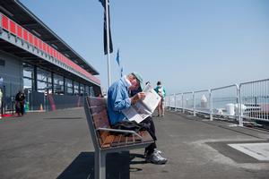 SAN FRANCISCO, USA, July 20th  a man reads the morning paper down at the America's park waiting for the days racing with only one boat. The Louis Vuitton Cup  sailed in AC 72s (July 7th - August  30th, the Americaâ€™s Cup Challenger Series, is used as the selection series to determine who will race the Defender in the Americaâ€™s Cup Finals.
Â©Paul Todd/OUTSIDEIMAGES.COM
OUTSIDE IMAGES PHOTO AGENCY photo copyright Paul Todd/Outside Images http://www.outsideimages.com taken at  and featuring the  class