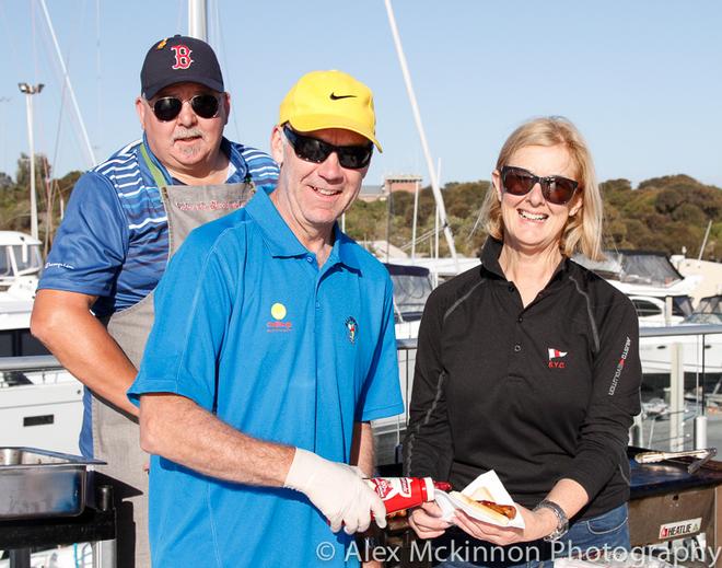 Challenge’s Ian Coutts serves SYC’s Kate Mitchell at the BBQ. - 2014-15 Club Marine Series ©  Alex McKinnon Photography http://www.alexmckinnonphotography.com
