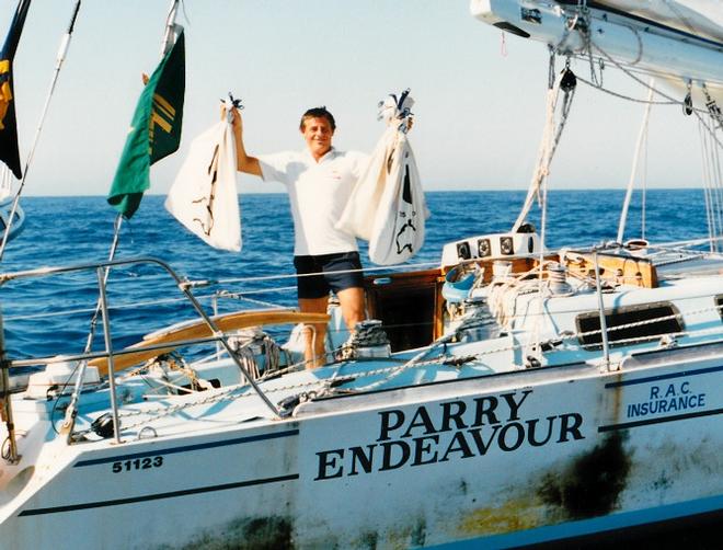 During his solo triple circumnavigation of the globe in 1987, Jon Sanders pauses off Fremantle to receive fan mail © Brian Jenkins