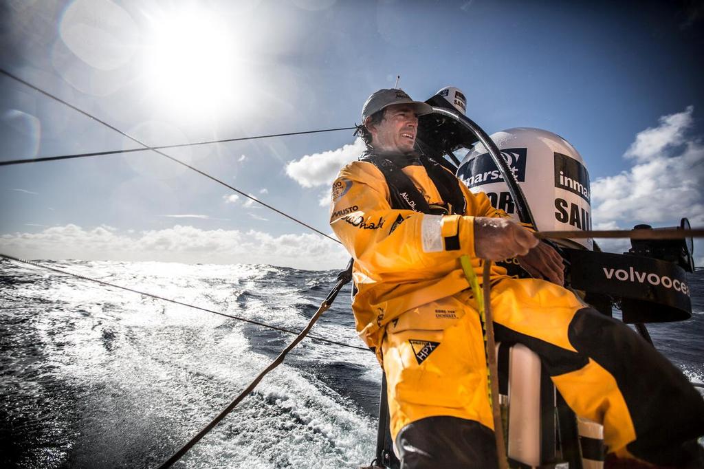 March 19, 2015. Leg 5 to Itajai onboard Abu Dhabi Ocean Racing. Day 01. Roberto Bermudez 'Chuny' sits on the aerial mast trimming the main in the heavy winds of the Southern Ocean. © Matt Knighton/Abu Dhabi Ocean Racing