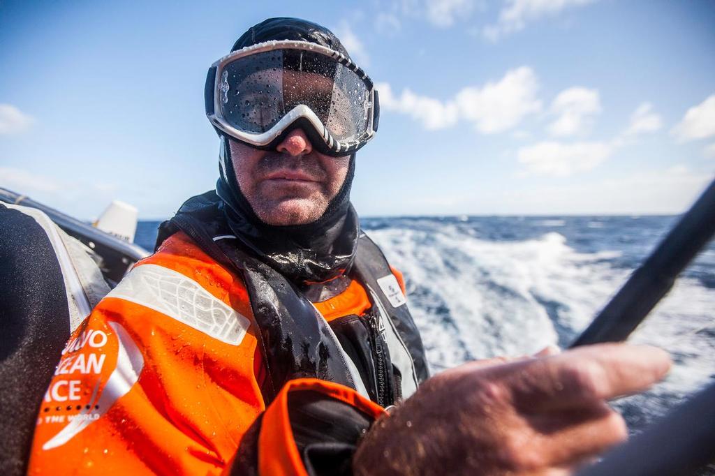 March 19, 2015. Leg 5 to Itajai onboard Team Alvimedica. Day 1. The still weakening Ex-Cylone Pam serves up a dosage of nastiness as the sea state continues to destabilize for the push to get east above it. Charlie Enright using clear ski goggles to shield his eyes from the spray. ©  Amory Ross / Team Alvimedica