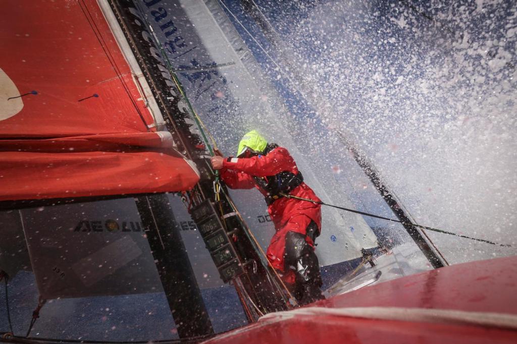 March 19, 2015. Leg 5 to Itajai onboard Dongfeng Race Team. Day 2. Kevin Escoffier cleaning halyards after a sail change © Yann Riou / Dongfeng Race Team