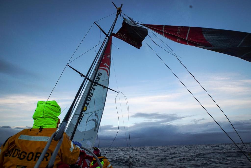 March 31, 2015. Leg 5 onboard Dongfeng Race Team. Kevin Escoffier cuts the broken part of the mast as the team enters the Beagle channel on its way to Ushuaia. © Yann Riou / Dongfeng Race Team