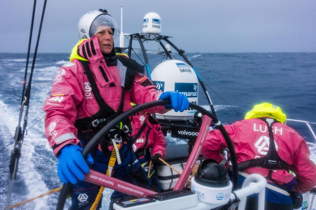 March 28, 2015. Leg 5 to Itajai onboard Team SCA. Day 11. Abby Ehler at the helm on full security and weather gear. © Anna-Lena Elled/Team SCA