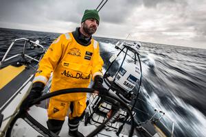 March 20,2015. Leg 5 to Itajai onboard Abu Dhabi Ocean Racing. Day 02. Ian Walker steers Azzam into the cold of the Southern Ocean. photo copyright Matt Knighton/Abu Dhabi Ocean Racing taken at  and featuring the  class
