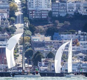 Express 37 Snowy Owl and J105 Jabberwocky with the cityfront in the background during the 2013 event - Rolex Big Boat Series photo copyright  Rolex/Daniel Forster http://www.regattanews.com taken at  and featuring the  class