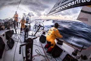 Onboard Abu Dhabi Ocean Racing - Roberto Bermudez 'Chuny' trims the A3 as dusk falls and the temperatures plummet on deck - Leg five to Itajai -  Volvo Ocean Race 2015 photo copyright Matt Knighton/Abu Dhabi Ocean Racing taken at  and featuring the  class