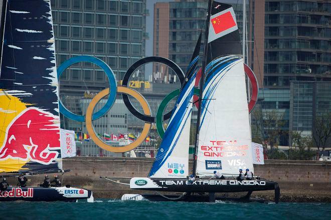 Team Extreme Qingdao race past the Olympic rings in 2014 - Extreme Sailing Series™ © Lloyd Images