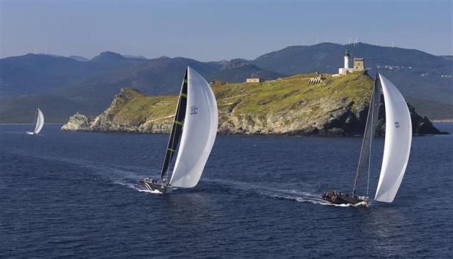 Maxi 72s Jethou (GBR), Stig (ITA) and Alegre (GBR) reach the Giraglia rock at Daybreak in the 2013 race - Giraglia Rolex Cup ©  Rolex / Carlo Borlenghi http://www.carloborlenghi.net