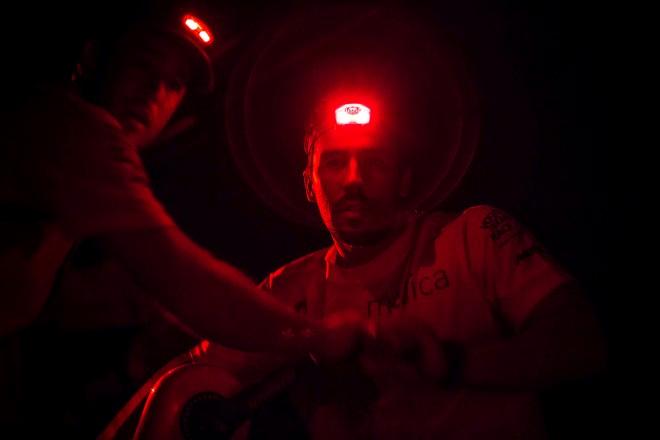 Leg six to Newport onboard Team Alvimedica. Day three. Mark Towill grinding the daggerboard up in a midnight manoeuvre from the pit. Conditions remain largely the same for the third consecutive day of upwind sailing east and away from a chasing cold front. - Volvo Ocean Race 2015 ©  Amory Ross / Team Alvimedica