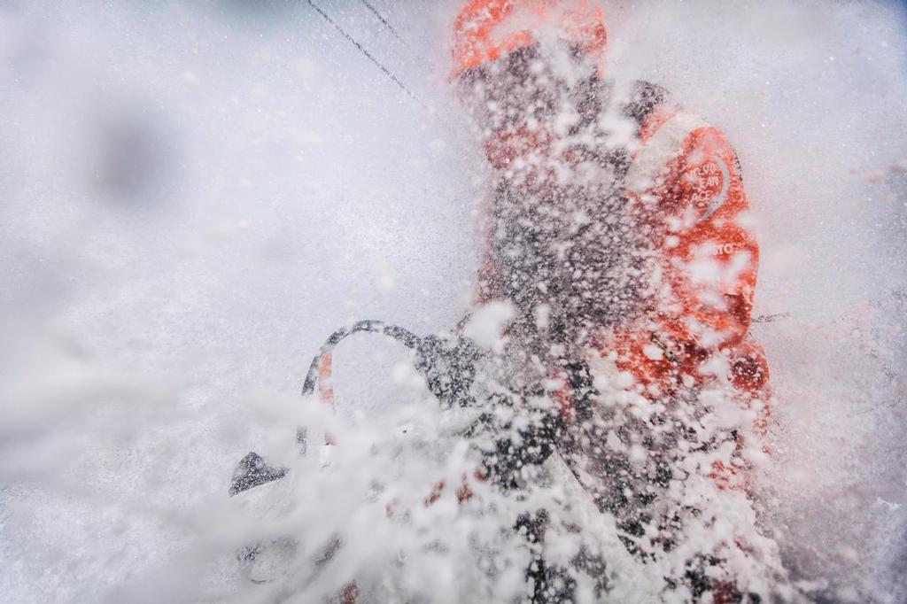April 1, 2015. Leg 5 to Itajai onboard Team Alvimedica. Day 15. Conditions worsen as the fleet outuns a nasty system of low pressure moving east off the coast of South America, with upwind sailing in 35-40 knots of wind creating uncomfortable sailing. Dave Swete driving upwind in wet and rough conditions. ©  Amory Ross / Team Alvimedica