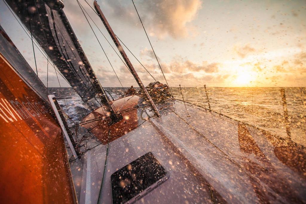 April 21, 2015. Leg 6 to Newport onboard Team Alvimedica. Day 02. The drag race east continues as the fleet tries to outrun a cold front coming from the west, bringing stronger winds and wetter conditions. The sun sets on a beautiful night off South America, close reaching at twenty knots with the whole fleet in sight. ©  Amory Ross / Team Alvimedica