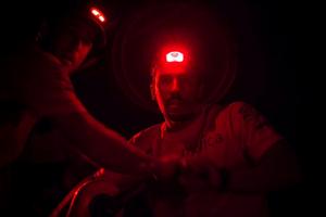 Leg six to Newport onboard Team Alvimedica. Day three. Mark Towill grinding the daggerboard up in a midnight manoeuvre from the pit. Conditions remain largely the same for the third consecutive day of upwind sailing east and away from a chasing cold front. - Volvo Ocean Race 2015 photo copyright  Amory Ross / Team Alvimedica taken at  and featuring the  class