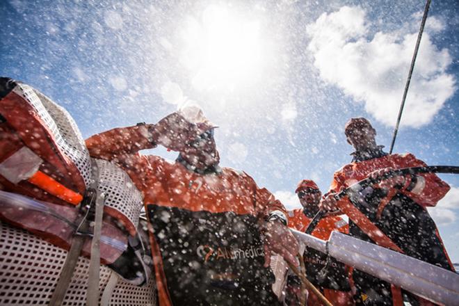 Leg 6 to Newport onboard Team Alvimedica. Day 11. Dave Swete ducks from the constant spray over the deck. The trade wind sailing continues,as does the occupation of the leaderboard's bottom--an unpleasant place to be even with the perfect conditions.  ©  Amory Ross / Team Alvimedica