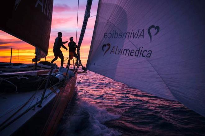 Leg 6 to Newport onboard Team Alvimedica. The sunset silhouettes the foredeck during a change from the masthead Code Zero to the A3 spinnaker. With less than 500 miles to Newport the complex winds again lighten before another cold front and an overnight forecast calling for the return of stronger winds. - Volvo Ocean Race 2015 ©  Amory Ross / Team Alvimedica