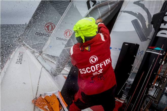 Leg 08 to Lisbon onboard Dongfeng Race Team. Day 16. Kevin Escoffier removing a sail from the bow after a sail change. - Volvo Ocean Race 2015 © Yann Riou / Dongfeng Race Team