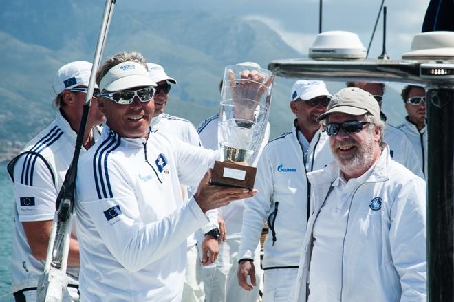 Jochen Schümann is presented with the Volcano Race's line honours trophy by IMA Secretary General Andrew McIrvine - 2015 Volcano Race © IMA/Gianluca Di Fazio