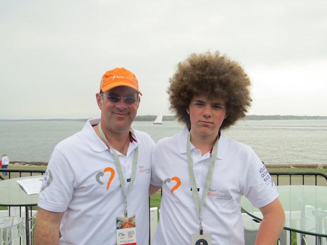 Justin and Kirby Kromelow of San Francisco at the ocean race club (with a perfectly timed 12-meter sailing in the background) © Kara Hugglestone