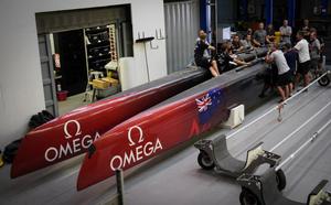 Emirates Team NZ sailing and shore crew consider the task ahead to convert the AC45 to become a foiler photo copyright Hamish Hooper/Emirates Team NZ http://www.etnzblog.com taken at  and featuring the  class