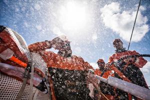 Leg 6 to Newport onboard Team Alvimedica. Day 11. Dave Swete ducks from the constant spray over the deck. The trade wind sailing continues,as does the occupation of the leaderboard's bottom--an unpleasant place to be even with the perfect conditions. photo copyright  Amory Ross / Team Alvimedica taken at  and featuring the  class