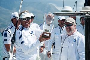 Jochen Schümann is presented with the Volcano Race's line honours trophy by IMA Secretary General Andrew McIrvine - 2015 Volcano Race photo copyright IMA/Gianluca Di Fazio taken at  and featuring the  class