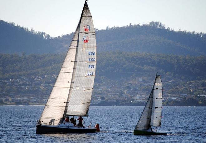 Largest and smallest yachts - the Farr 40 War Games and the I550 sportsboat Squiggle - at the leewaard mark in first and last places in the fleet - 2015 Derwent Sailing Squadron Winter Race ©  Peter Campbell