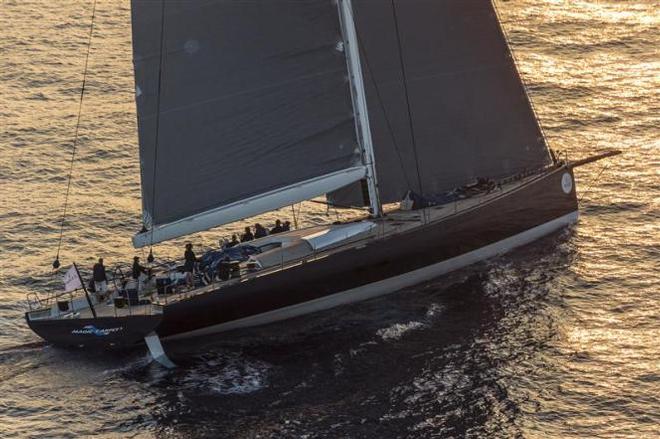 Magic Carpet Cubed, GBR slowly approaching the Giraglia Rock - 2015 Giraglia Rolex Cup ©  Rolex / Carlo Borlenghi http://www.carloborlenghi.net