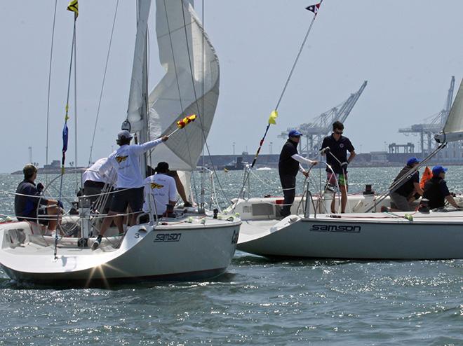 LBYC's Dustin Durant (at helm) raises flag asking for a penalty against SFYC's Shawn Bennett, after Bennett makes contact with Durant's boat during the 2015 San Francisco Perpetual Challenge Cup match race regatta. © Rick Roberts 