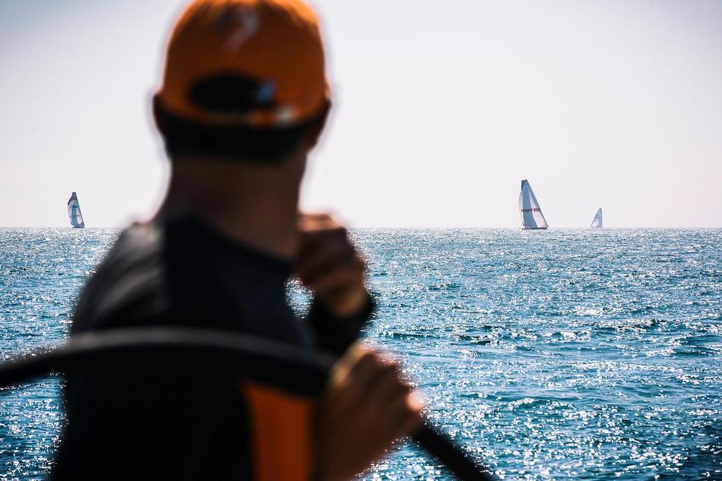 June 17, 2015. Leg 9 to Gothenburg onboard Team Alvimedica. Day 1. Free from the Bay of Biscay the fleet rounds Brest on the way to the English Channel, all within close proximity. Alberto Bolzan looks over his shoulder at the competition lining up in the rearview mirror. ©  Amory Ross / Team Alvimedica