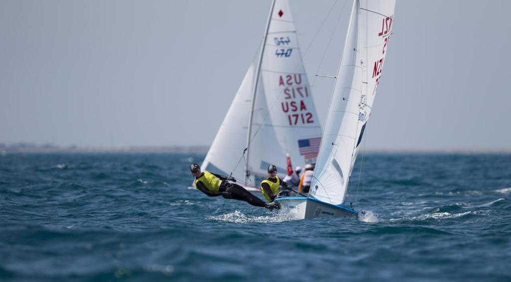 Jo Aleh and Polly Powrie, NZL, Women's Two Person Dinghy (470) being followed by Anne Haeger and Birana Provancha, USA, Women's Two Person Dinghy (470) at Day Two of the ISAF Sailing World Cup Weymouth & Portland. © onEdition http://www.onEdition.com