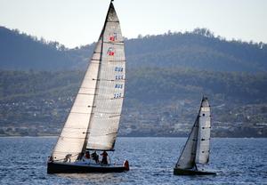 Largest and smallest yachts - the Farr 40 War Games and the I550 sportsboat Squiggle - at the leewaard mark in first and last places in the fleet - 2015 Derwent Sailing Squadron Winter Race photo copyright  Peter Campbell taken at  and featuring the  class