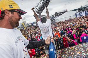 Azzam's Boat Captain Daryl Wislang sprays sparkling date juice as Adil Khalid holds aloft the Volvo Ocean Race trophy in Gothenburg photo copyright Ian Roman / Volvo Ocean Race taken at  and featuring the  class