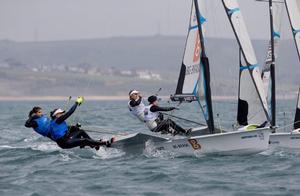 Martine Soffiatti Grael and Kahena Kunze, BRA, Paris Henken and Helena Scutt, USA, Women's Skiff (49erFX) on day four - 2015 ISAF Sailing WC Weymouth and Portland photo copyright onEdition http://www.onEdition.com taken at  and featuring the  class