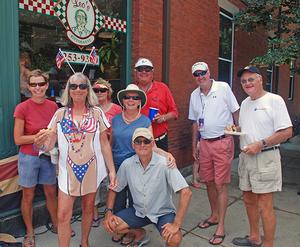 Salty Dawgs at the Bristol 4th of July parade, outside Leo’s Ristorante on the parade route. Photo includes Jenny McNamara (in patriotic T-shirt), Charlie McNamara, Sarah Bell, Craig and Karene White, Gil and Joy Smith, and SDR co-founder Bill Knowles (at right). photo copyright Hank George taken at  and featuring the  class