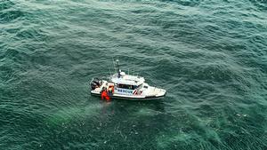 Wooli 30 training at sea with rescue dummy photo copyright Ken McManus taken at  and featuring the  class